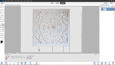A picture of a user removing pixels by using the Magic Eraser Tool in Photoshop Elements.