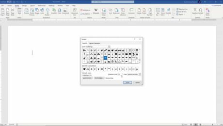 Insert a Symbol in Word- Instructions and Video Lesson: A picture of a user adding a symbol to a document using the “Symbol” dialog box in Word.