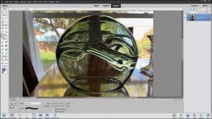 A picture of a user applying the Smudge Tool in Photoshop Elements.