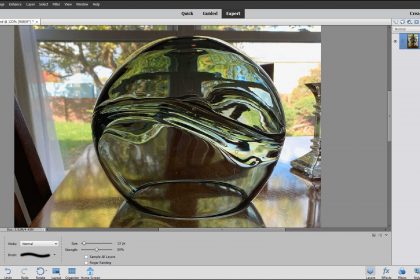 A picture of a user applying the Smudge Tool in Photoshop Elements.