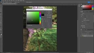 A picture of a user setting the foreground color using the Color Picker in Photoshop.
