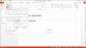 Insert a New Slide in PowerPoint- Tutorial: A picture of a user inserting a new slide into a presentation in PowerPoint 2013.