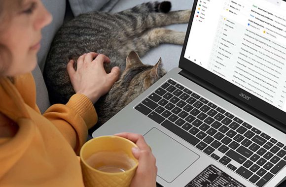 chromebook-keyboard-shortcuts-sticker-black-small-woman-using A picture of a woman using the Chromebook keyboard shortcuts sticker.