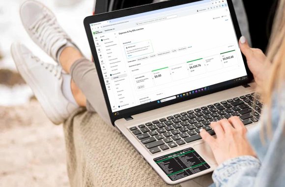 quickbooks-online-keyboard-shortcuts-sticker-black-woman-vacation A picture of a woman using the QuickBooks Online Keyboard Shortcuts sticker.